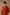 A man burnt orange long-sleeve kurta .